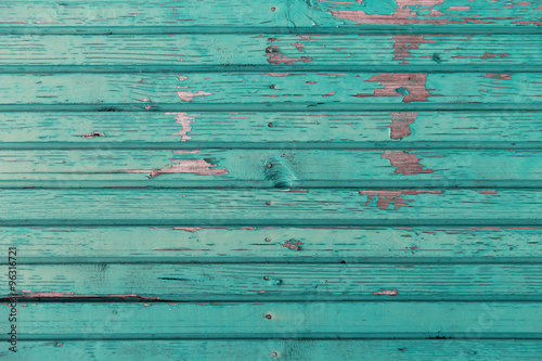 old wooden boards painted in blue background