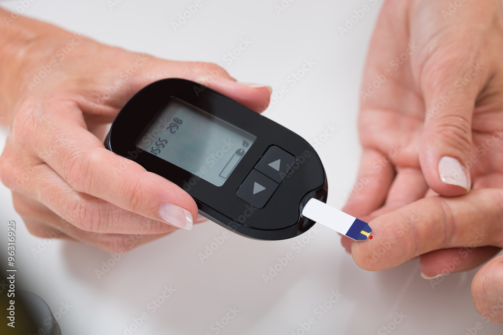 Doctor Measuring Sugar Reading Of Patient Doctor Measuring Sugar Reading Of Patient