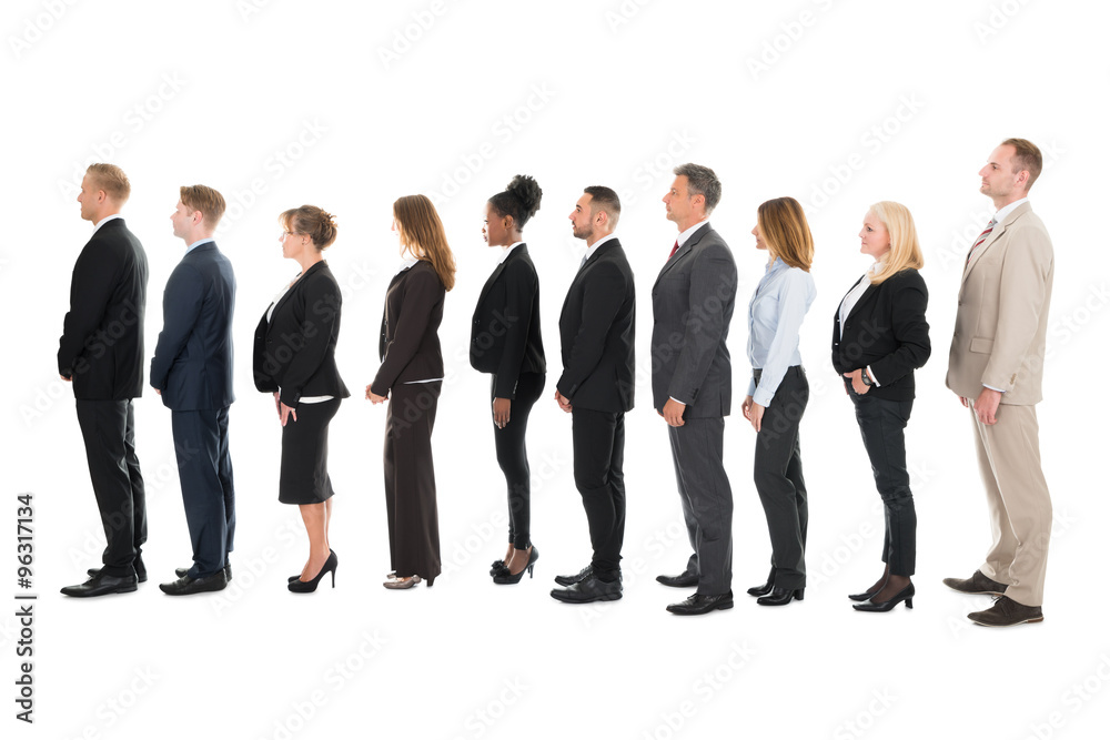 Side View Of Business Team Standing In Row Side View Of Business Team Standing In Row