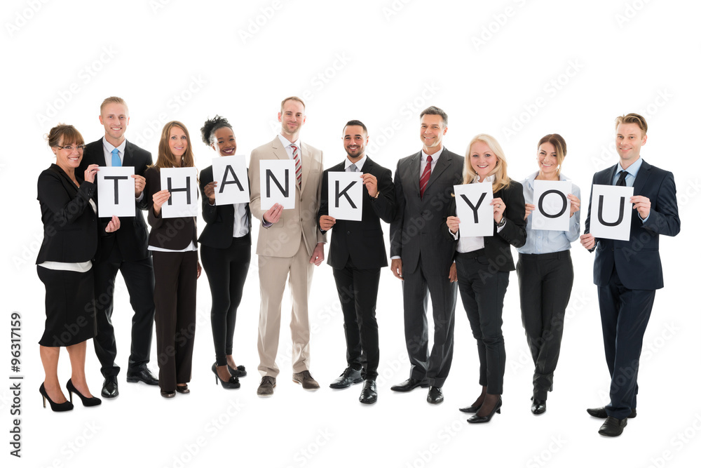 Obraz premium Portrait Of Smiling Business Team Holding Thank You Sign