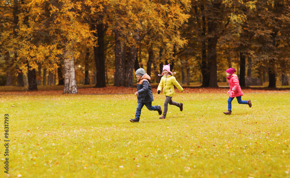 Fototapeta premium group of happy little kids running outdoors