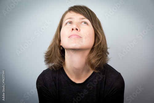 Young beautiful woman model studio face expressions portrait cheerful. © subbotsky