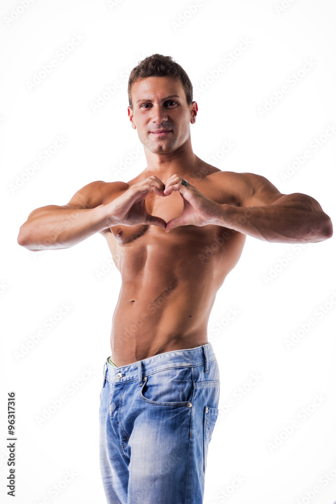 Young man making heart sign with his hands and fingers Young man making heart sign with his hands and fingers