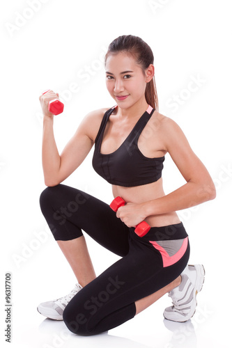 Portrait of young woman doing exercise with lifting weights