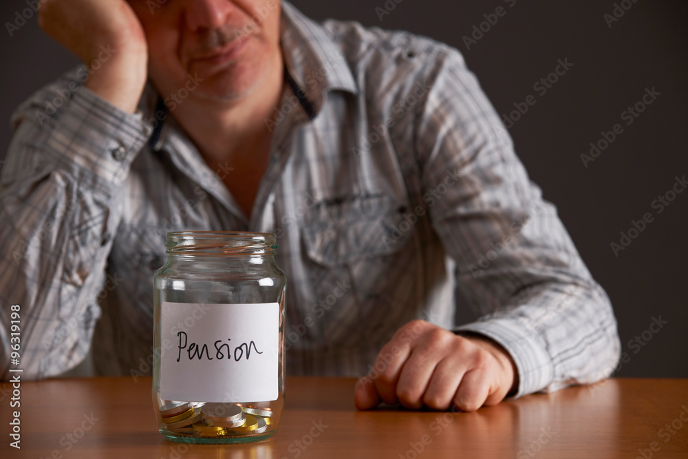Depressed Man Looking At Empty Jar Labelled Pension Depressed Man Looking At Empty Jar Labelled Pension
