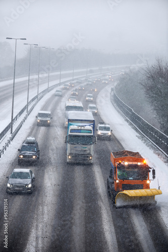 Snowplough Clearing Motorway During Winter