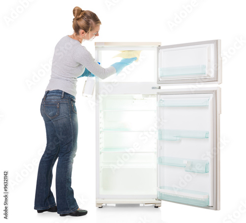Young Woman Cleaning Refrigerator