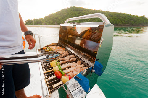 Fototapete Barbecue preparing for a party on the luxury catamaran yacht