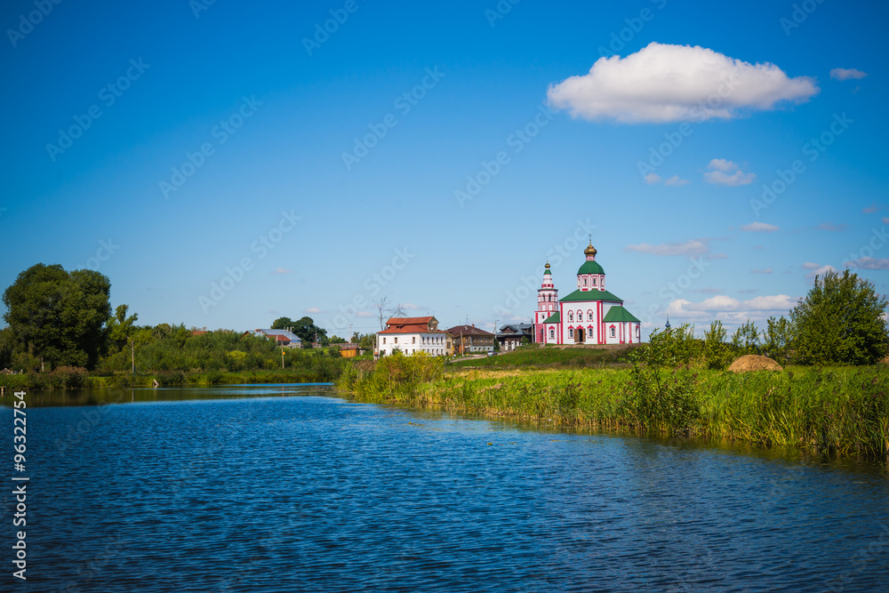 Fototapeta premium Russia. Suzdal. View of the river Kamenka and Church of St. Elias