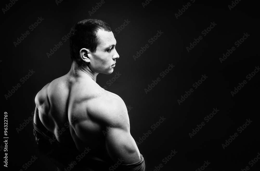 Muscled male model showing his back Muscled male model showing his back
