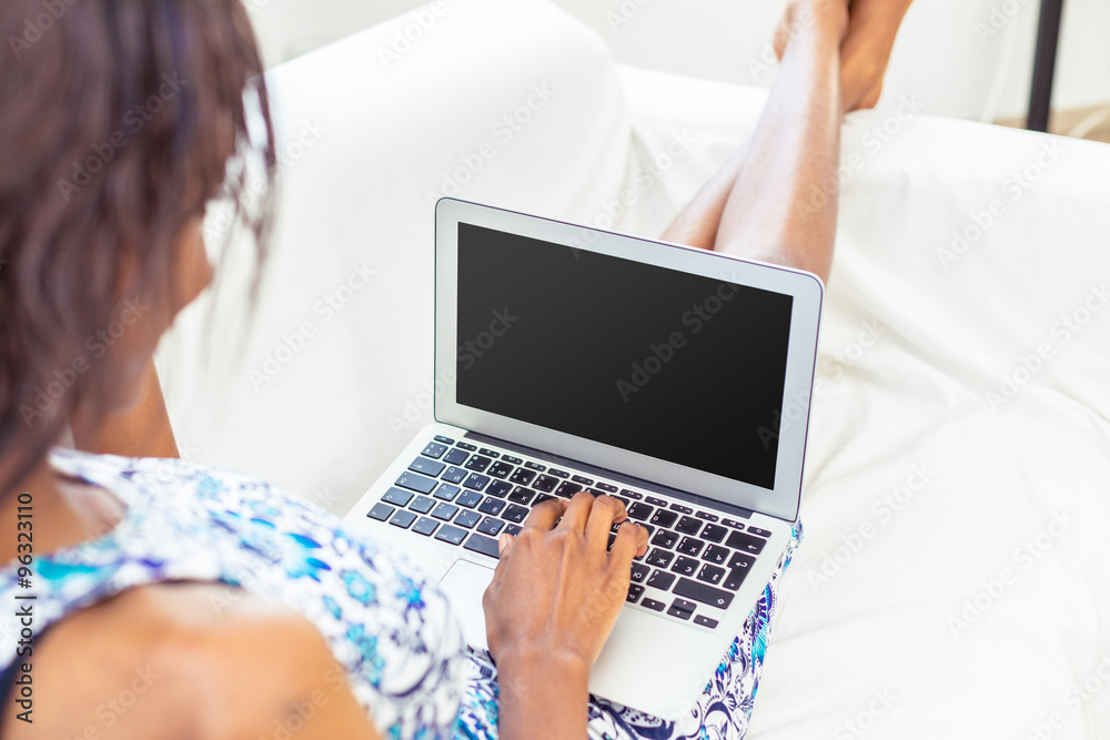African American woman relaxing on couch African American woman relaxing on couch