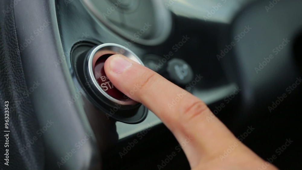Car driver starting the engine Car driver starting the engine