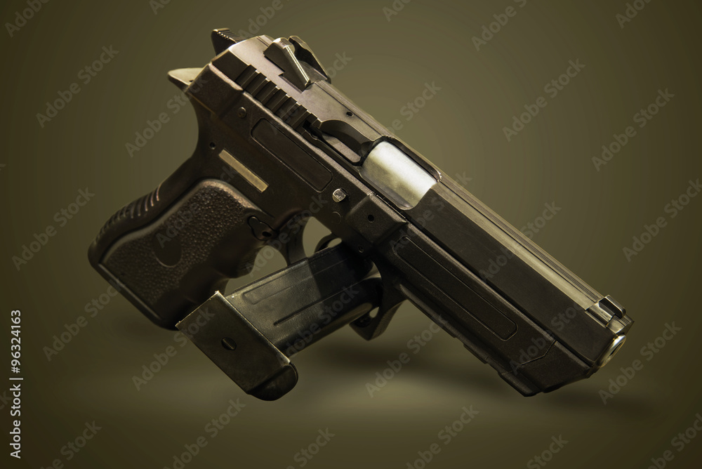 pistol gun on the green background
