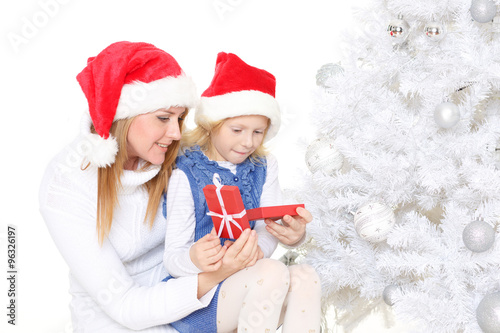 Happy family with Christmas gift.
