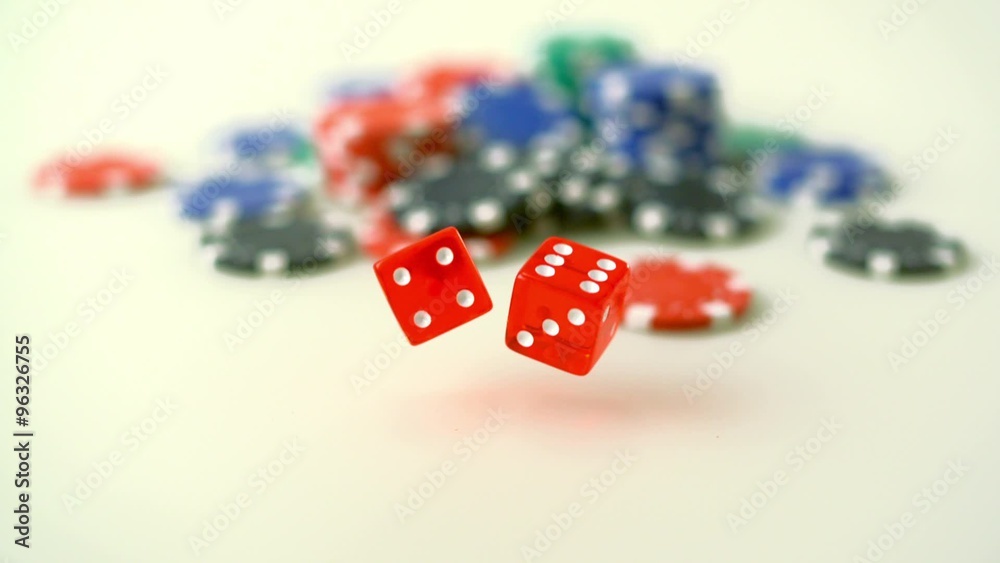 Throwing dice in front of casino chips shooting with high speed camera, phantom Throwing dice in front of casino chips shooting with high speed camera, phantom
