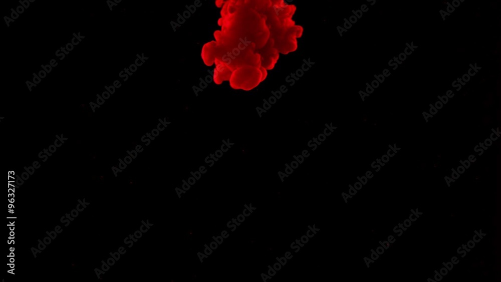 Red ink dropped in water on black background shooting with high speed camera, phantom flex.