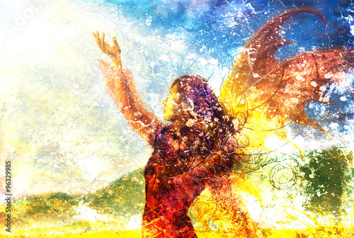 Fotografie painting fairy woman in a historic dress standing in rays of sunlight amids a wild meadow