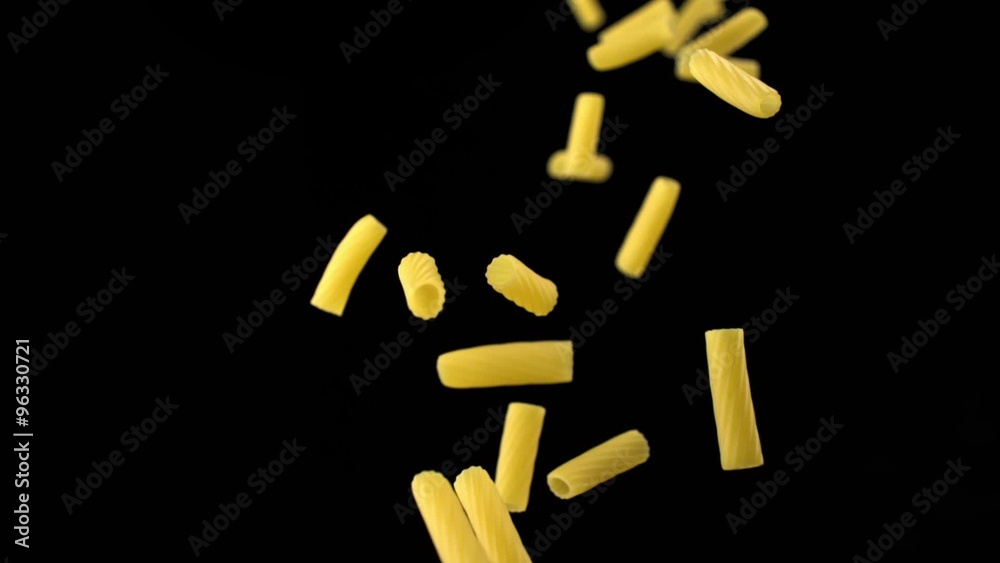 Throwing tortiglioni pasta on black background shooting with high speed camera, phantom flex. Throwing tortiglioni pasta on black background shooting with high speed camera, phantom flex.