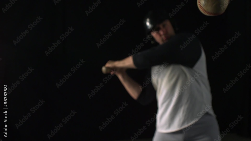 Baseball player hitting ball with bat shooting with high speed camera, phantom flex.