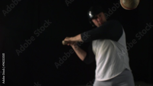 Baseball player hitting ball with bat shooting with high speed camera, phantom flex.