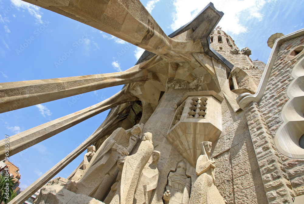 Naklejka premium BARCELONA, CATALONIA, SPAIN - AUGUST 29, 2008: Passion facade of Sagrada Familia Temple, Barcelona,Catalonia, Spain