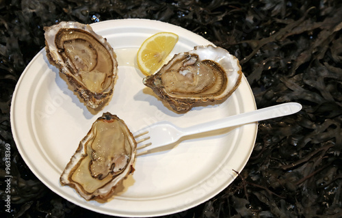 delicious raw oysters served with lemon