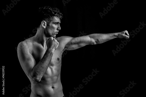 Man punching in black and white 
