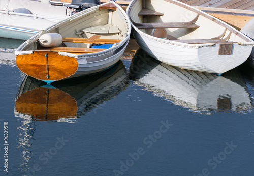 White Rowboats Reflecting in Water © junej