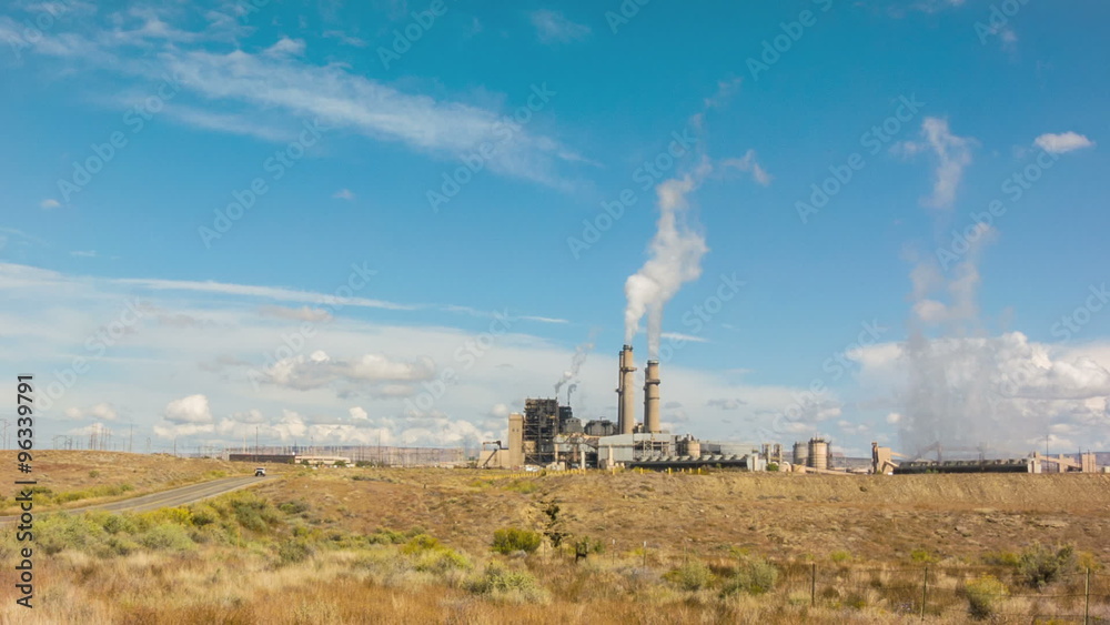 Wide panorama vista shot of electricity power plant generating station with smoke from chimneys stacks