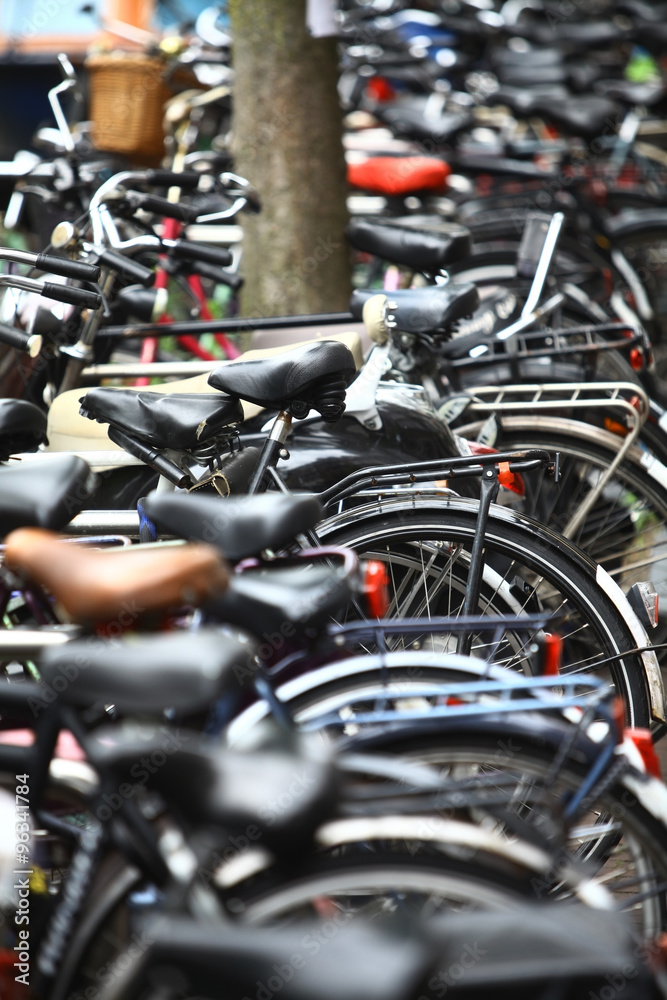 Group of parked bicycles Group of parked bicycles