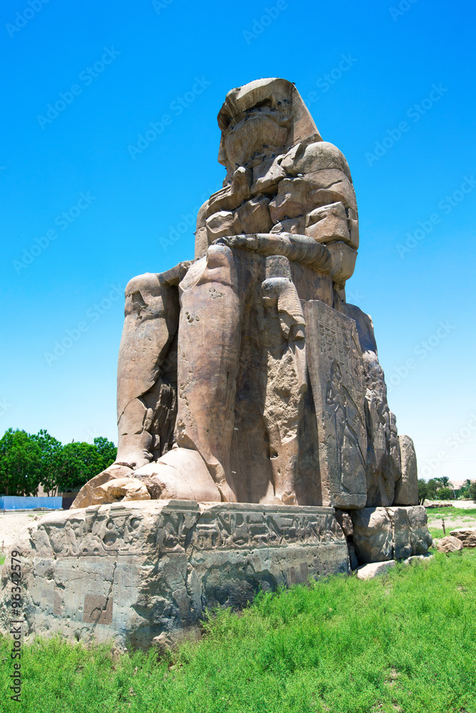  two massive stone statues of Pharaoh Amenhotep III