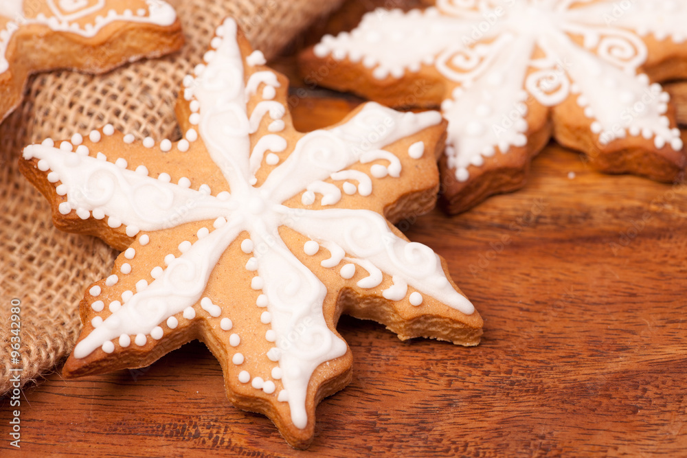 Gingerbread christmas cookies on a wooden background Gingerbread christmas cookies on a wooden background