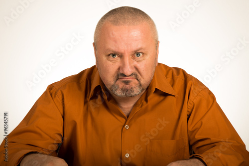 A close up of a angry man on white background