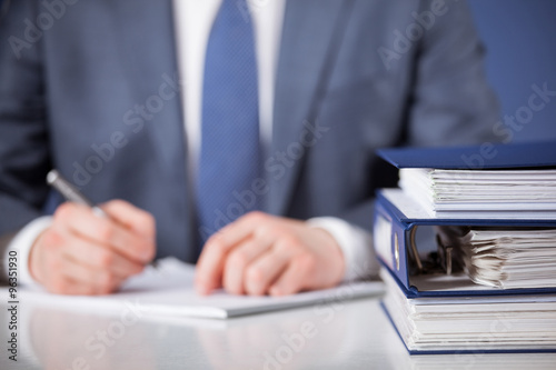 Businessman signing documents