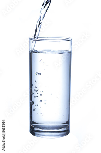 Glass with water splash on white background