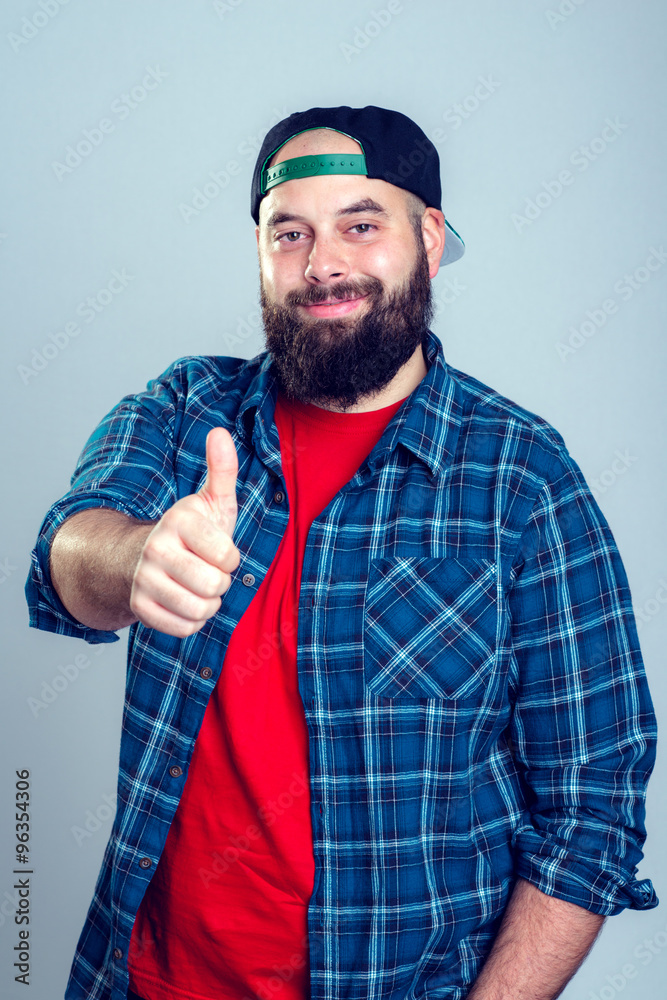 bearded man with baseball cap with thumb up bearded man with baseball cap with thumb up