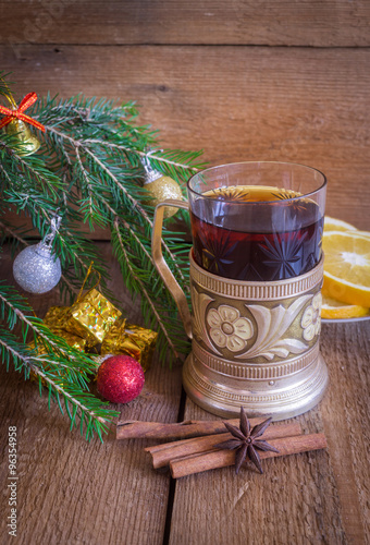 Christmas and new year decoration, tea in vintage glass with coaster 