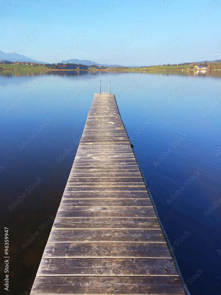 Jetty on lake Hopfensee in Bavaria