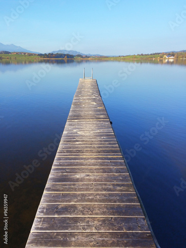 Jetty on lake Hopfensee in Bavaria