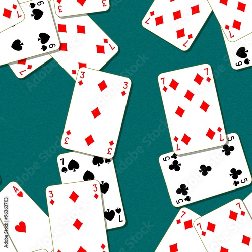 Playing cards scattered on a green table. Seamless pattern texture background. The table in the gaming casino.