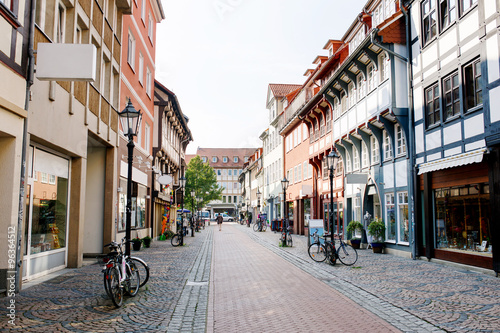 Old town street in the town of Goettingen, Lower Saxony, Germany. Numerous shops. Cobblestone street