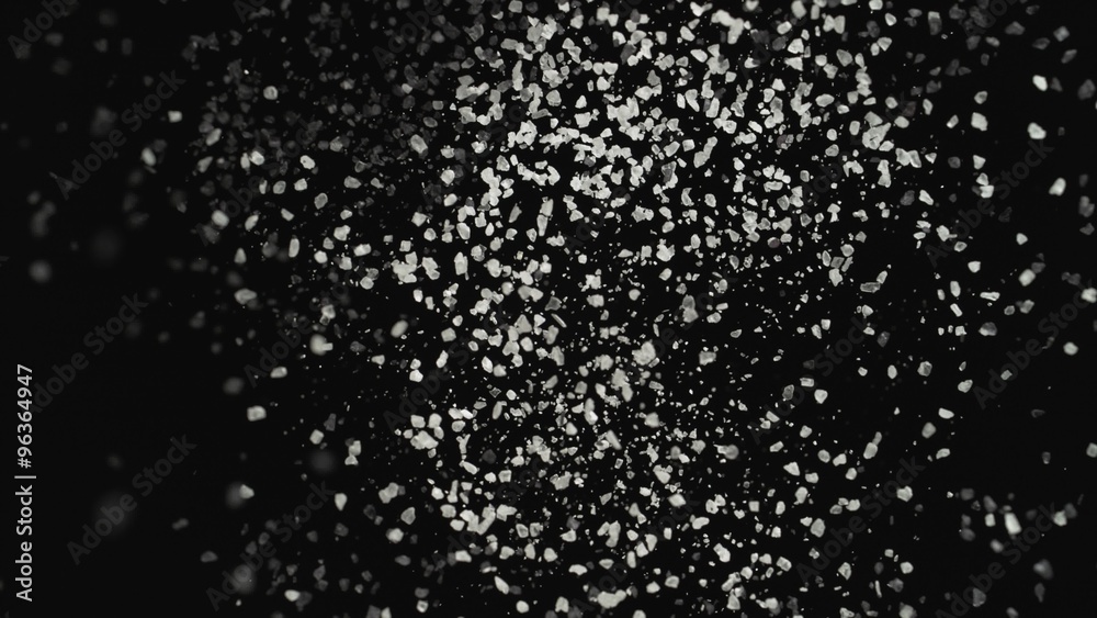 4K 30fps, White particles fly after being exploded against black background shot with high speed camera, phantom flex 4K.
