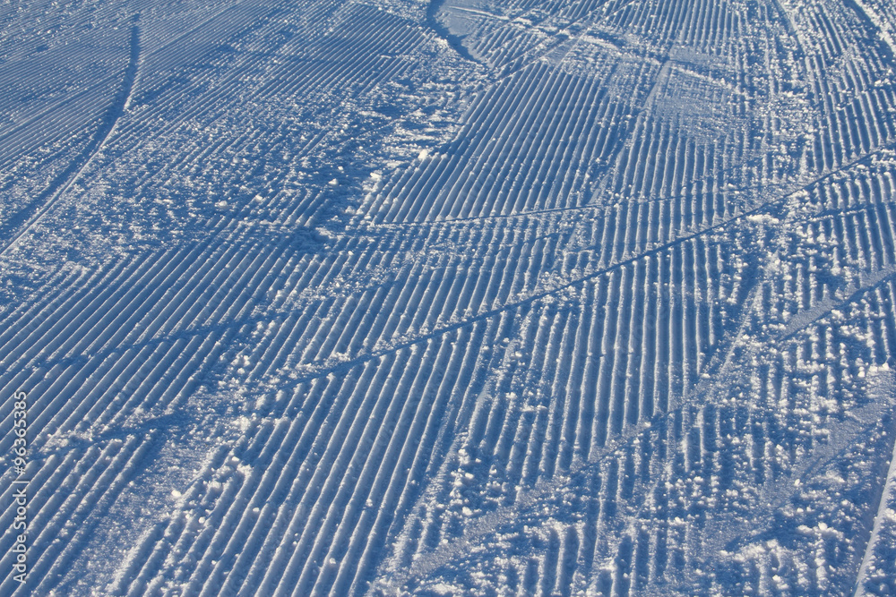 Fresh snow groomer tracks