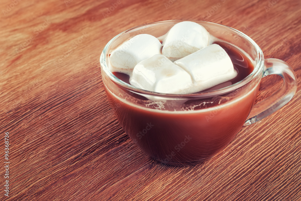 cup of hot chocolate with marshmallows on wooden background cup of hot chocolate with marshmallows on wooden background