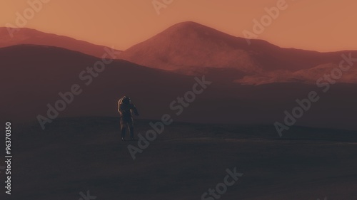 Fototapeta Naklejka Na Ścianę i Meble -  Astronaut walking on red planet.