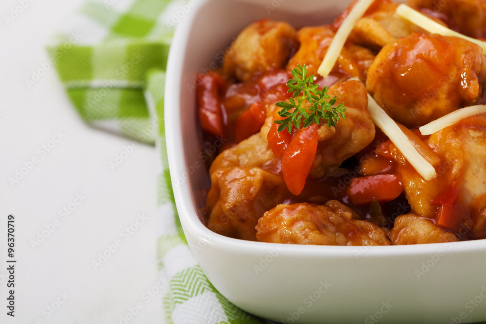 Fried chicken pieces in batter with sweet and sour sauce Fried chicken pieces in batter with sweet and sour sauce