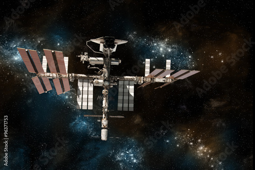 Fototapeta Naklejka Na Ścianę i Meble -  The International Space Station with the space shuttle docked on against a background of stars.