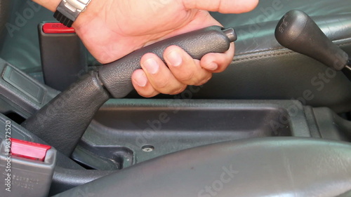 pulling handbrake of a car
