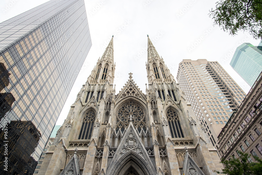 Saint Patrick cathedral in the middle of the midtown buildings of manhattan, new-york city