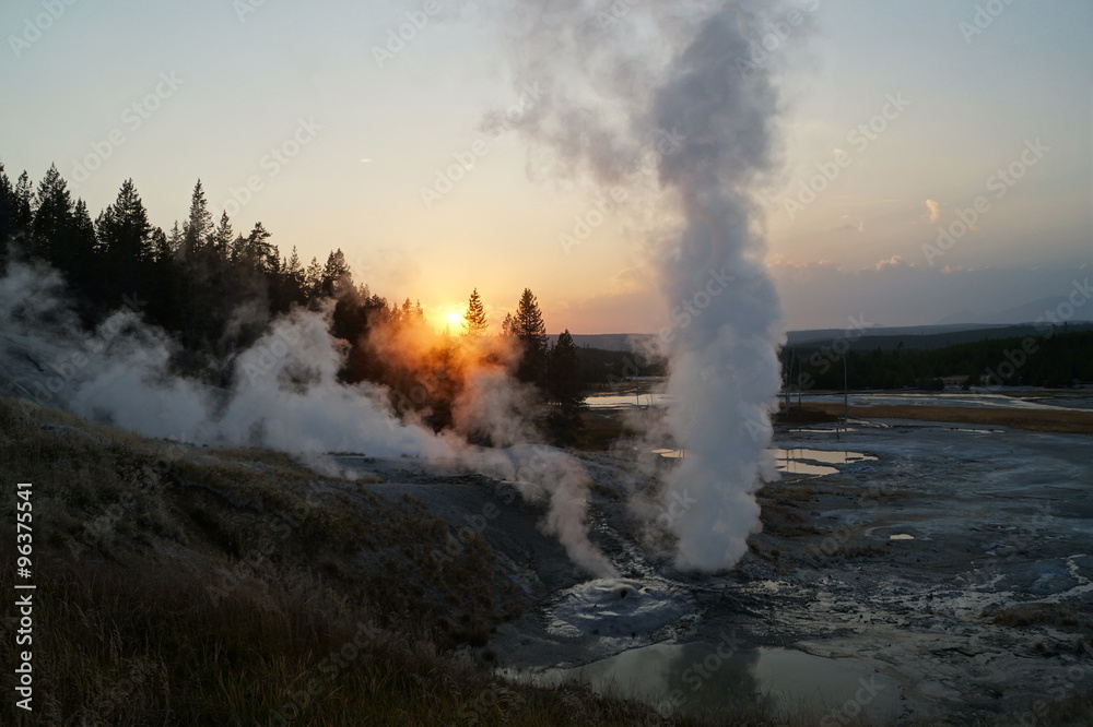 Sunset in the smoke of geysers in Yellowstone National Park